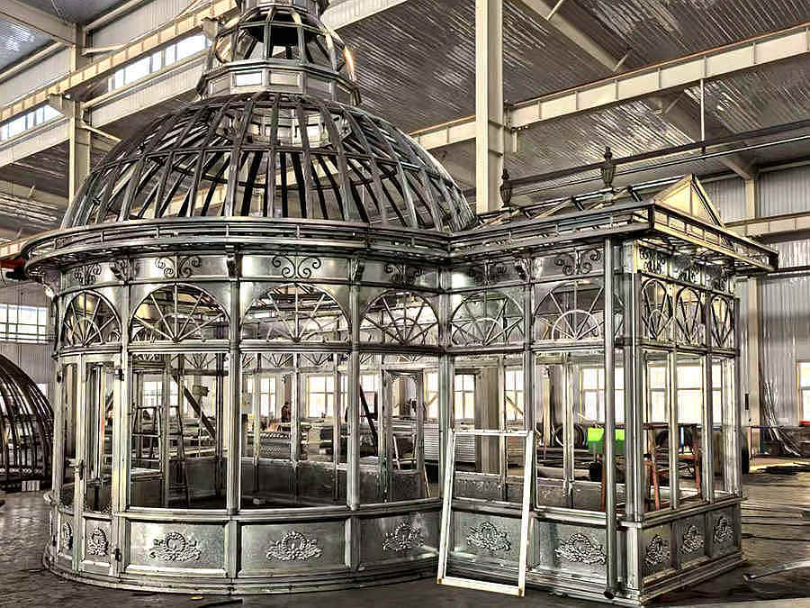 Side perspective hot‑dip galvanized steel victorian conservatory dome frame industrial workshop setting